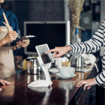 paying for coffee on a tablet